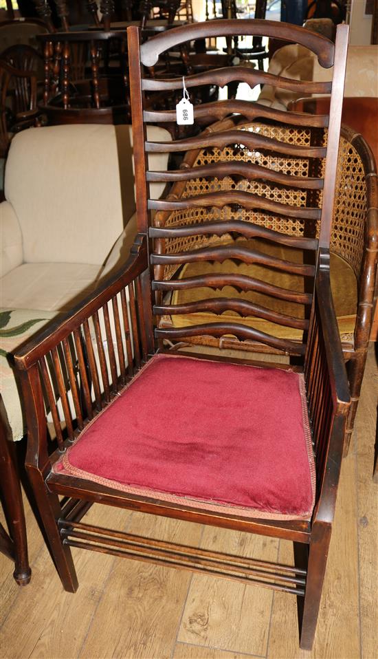 An Edwardian Arts & Crafts stained beech ladderback armchair